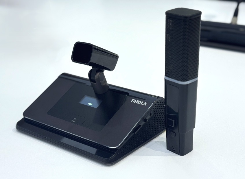 TAIDEN conference system with a table unit and a wireless microphone.