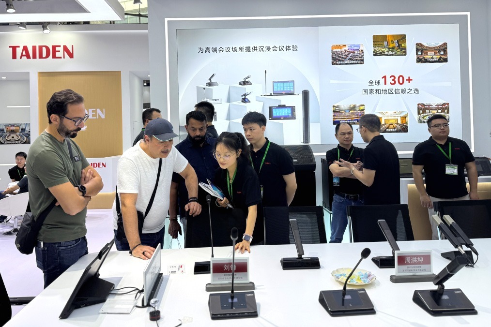 TAIDEN exhibition stand featuring conference systems and consultation sessions